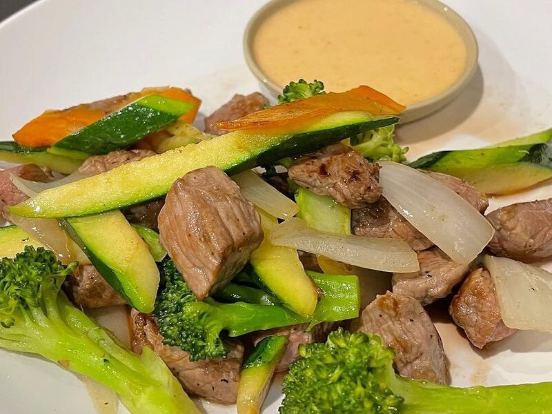 Hibachi steak with broccoli, zucchini, onion, carrot and white sauce